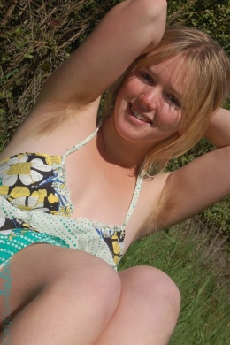 ana relaxes in the meadow